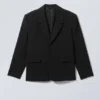 Blazer entallado de corte holgado y botonadura simple – Negro Blazer entallado de corte holgado y botonadura simple – Negro