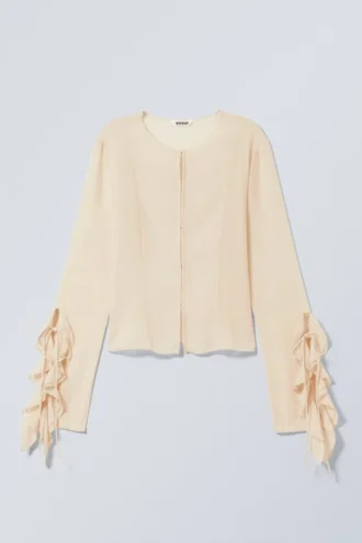 Blusa de manga larga con volantes – Beige