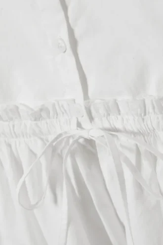 Blusa de popelín de algodón con peplum – Blanca