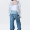 Blusa transparente con cuello en V y volantes – Azul claro