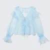 Blusa transparente con cuello en V y volantes – Azul claro