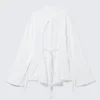 Camisas de manga larga con espalda abierta y lazo – Blanca