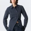 Camisas entalladas asimétricas de popelín – Rayas azul oscuro Camisas entalladas asimétricas de popelín – Rayas azul oscuro