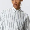 Camisas holgadas de popelín con botones – Blanca – Rayas azules Camisas holgadas de popelín con botones – Blanca – Rayas azules