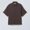 Camisas oversize estructuradas de manga corta – Marrón oscuro Camisas oversize estructuradas de manga corta – Marrón oscuro