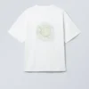Camiseta con estampados de corte recto – Blanca – Símbolo verde Camiseta con estampados de corte recto – Blanca – Símbolo verde