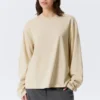 Camiseta de algodón de manga larga y corte recto – Beige claro Camiseta de algodón de manga larga y corte recto – Beige claro