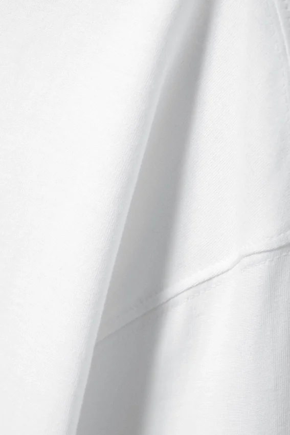Camiseta de algodón de manga larga y corte recto – Blanca Camiseta de algodón de manga larga y corte recto – Blanca