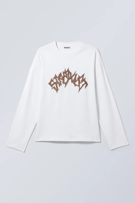 Camiseta de manga larga con estampados gráficos y corte holgado – Blanca – Stardust Camiseta de manga larga con estampados gráficos y corte holgado – Blanca – Stardust
