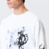 Camiseta de manga larga con estampados y corte holgado – Blanca – Airways Camiseta de manga larga con estampados y corte holgado – Blanca – Airways