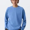 Camiseta holgada de manga larga – Azul lavado Camiseta holgada de manga larga – Azul lavado