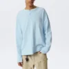 Camiseta holgada de manga larga con cuello Henley – Azul claro Camiseta holgada de manga larga con cuello Henley – Azul claro