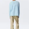 Camiseta holgada de manga larga con cuello Henley – Azul claro Camiseta holgada de manga larga con cuello Henley – Azul claro