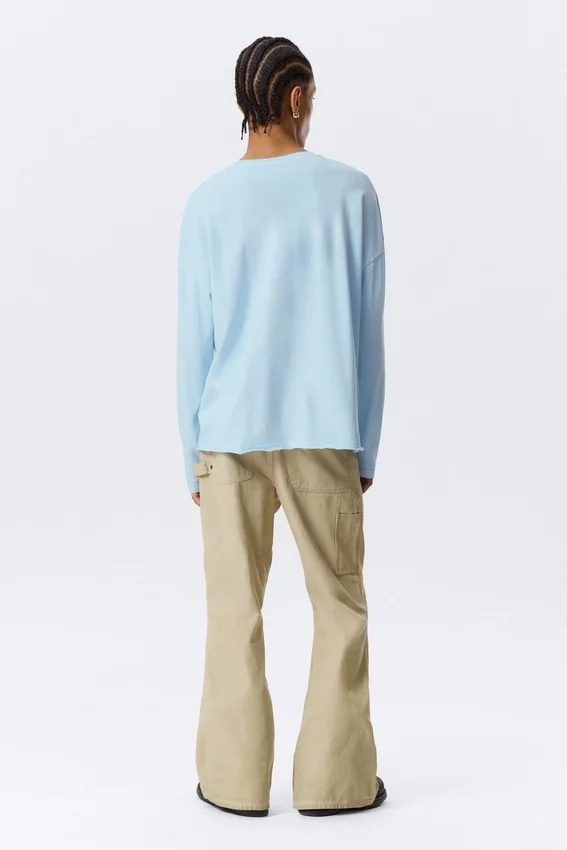 Camiseta holgada de manga larga con cuello Henley – Azul claro Camiseta holgada de manga larga con cuello Henley – Azul claro