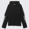 Camiseta oversize de manga larga y doble capa – Negro – Blanco tribal Camiseta oversize de manga larga y doble capa – Negro – Blanco tribal
