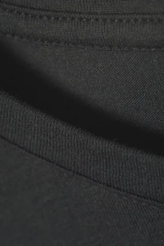 Camiseta sin mangas oversize – Oscura