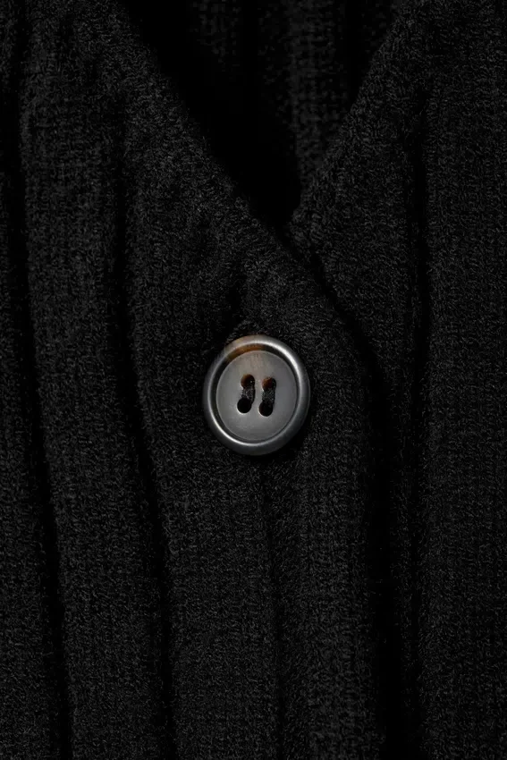 Chaleco de punto elástico con cuello en V – Negro Chaleco de punto elástico con cuello en V – Negro