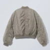 Chaqueta bomber corta con ojales – Dusty Mole Chaqueta bomber corta con ojales – Dusty Mole