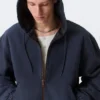 Chaqueta bomber holgada con capucha – Azul marino lavado Chaqueta bomber holgada con capucha – Azul marino lavado