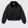 Chaqueta bomber holgada con cuello de piel sintética – Negro Chaqueta bomber holgada con cuello de piel sintética – Negro
