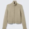 Cárdigan ajustado de punto suave con cremallera – Beige jaspeado