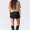 Falda mini de traje de talle bajo y corte ajustado – Negro