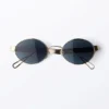 Gafas de sol ovaladas con montura metálica minimalista – Doradas – Lentes azul oscuro Gafas de sol ovaladas con montura metálica minimalista – Doradas – Lentes azul oscuro