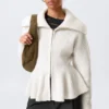 Jerséu con cremallera y peplum de punto elástico – Blanco