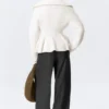 Jerséu con cremallera y peplum de punto elástico – Blanco