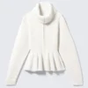 Jerséu con cremallera y peplum de punto elástico – Blanco