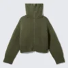 Jerséu de punto con cuello de embudo y doble cremallera – Verde caqui Jerséu de punto con cuello de embudo y doble cremallera – Verde caqui
