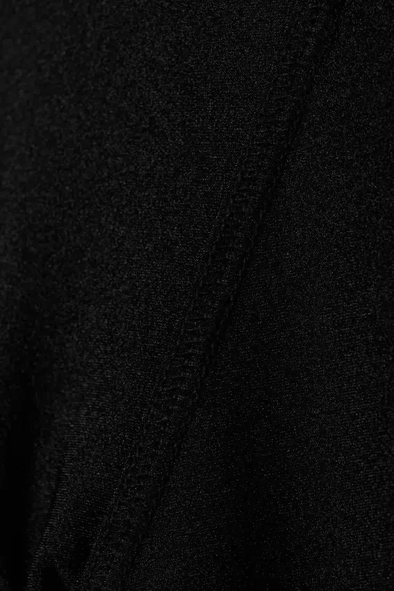 Leggings de nailon con bajo acampanado y abertura – Negro Leggings de nailon con bajo acampanado y abertura – Negro