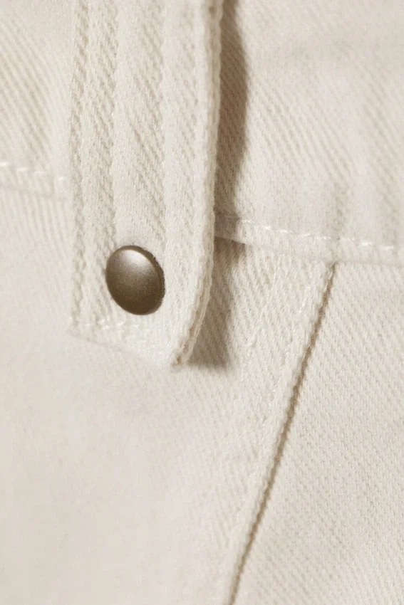 Mini falda asimétrica de sarga con flecos – Blanco roto Mini falda asimétrica de sarga con flecos – Blanco roto