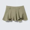 Mini falda asimétrica de sarga con flecos – Verde caqui Mini falda asimétrica de sarga con flecos – Verde caqui