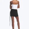 Mini falda cruzada con tirantes – Negra Mini falda cruzada con tirantes – Negra