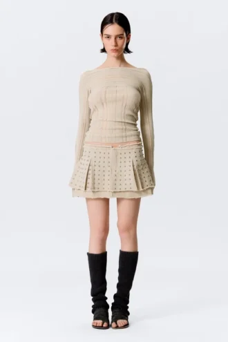 Minifalda plisada con tachuelas – Beige