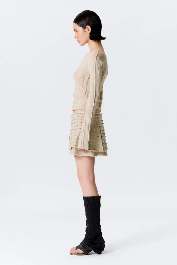 Minifalda plisada con tachuelas – Beige Minifalda plisada con tachuelas – Beige