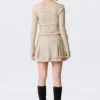 Minifalda plisada con tachuelas – Beige Minifalda plisada con tachuelas – Beige