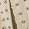 Minifalda plisada con tachuelas – Beige Minifalda plisada con tachuelas – Beige
