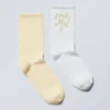 Pack de 2 pares de calcetines con estampados suaves – Amarillo y blanco Pack de 2 pares de calcetines con estampados suaves – Amarillo y blanco