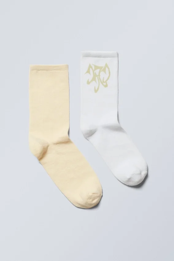 Pack de 2 pares de calcetines con estampados suaves – Amarillo y blanco Pack de 2 pares de calcetines con estampados suaves – Amarillo y blanco
