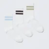Pack de 3 pares de calcetines deportivos a rayas – Blanco – Azul/Negro/Beige Pack de 3 pares de calcetines deportivos a rayas – Blanco – Azul/Negro/Beige