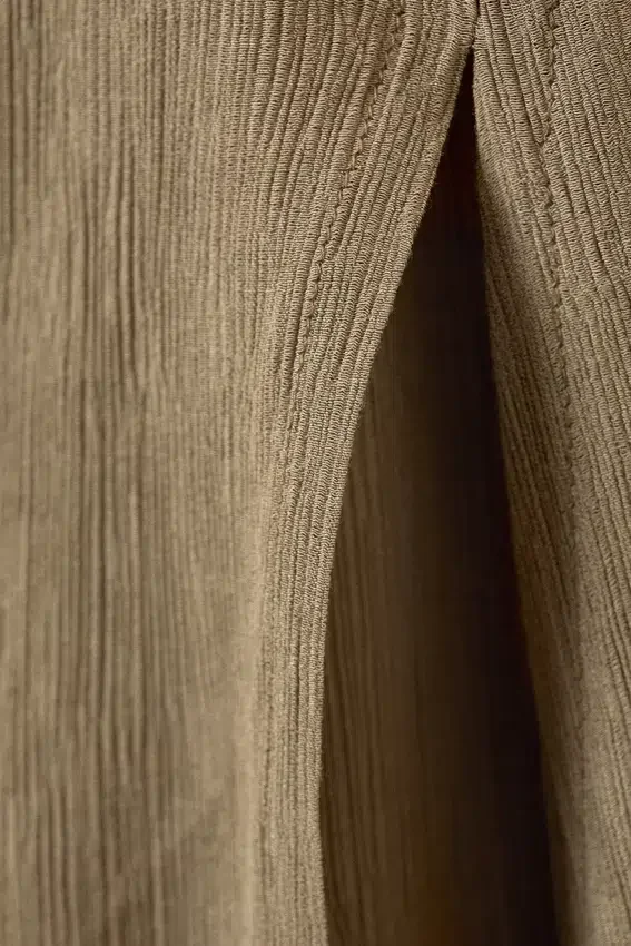 Pantalones acampanados de talle bajo y efecto arrugado – Beige Pantalones acampanados de talle bajo y efecto arrugado – Beige
