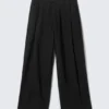 Pantalones anchos de corte holgado con pliegues – Negro Pantalones anchos de corte holgado con pliegues – Negro