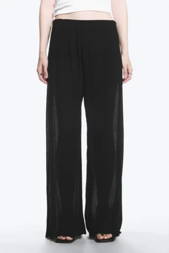 Pantalones anchos de talle bajo con efecto arrugado – Negro