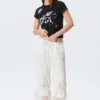 Pantalones bombachos de talle bajo con ribete de encaje de Rosabel – Blanco Pantalones bombachos de talle bajo con ribete de encaje de Rosabel – Blanco