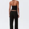 Pantalones bootcut de talle bajo y tejido suave – Negro