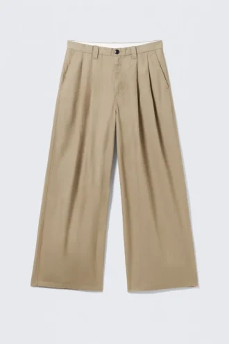 Pantalones chinos de sarga de algodón plisados oversize Otis – Beige