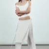 Pantalones con falda de talle medio y tachuelas – Blanco roto Pantalones con falda de talle medio y tachuelas – Blanco roto
