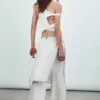 Pantalones con falda de talle medio y tachuelas – Blanco roto Pantalones con falda de talle medio y tachuelas – Blanco roto